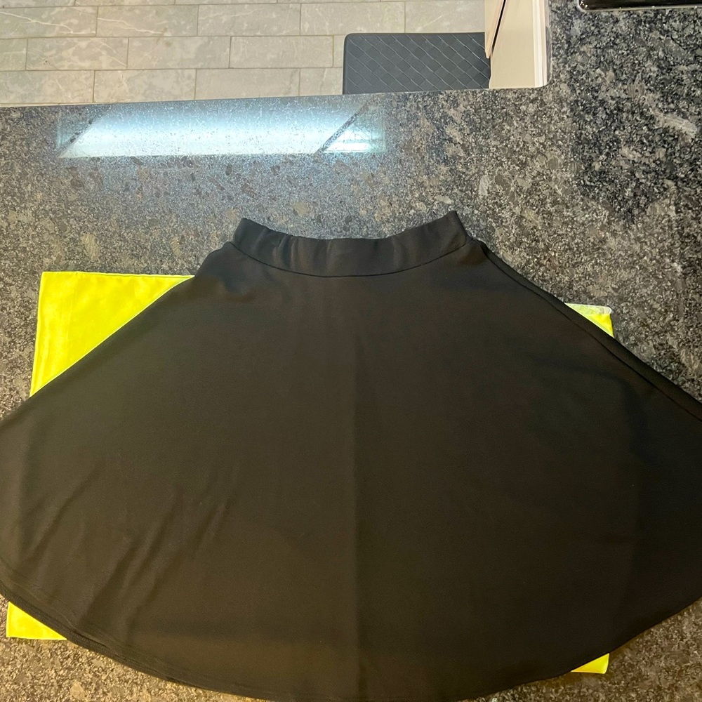 Black Twirl Skirt. 24” long. Size L.